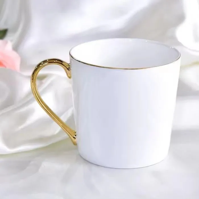 Wholesale gold handle ceramic mug white bone china christmas mug with logo